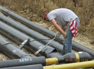 Heggemann Inc. worker servicing pipes outside Bowling Green Prison