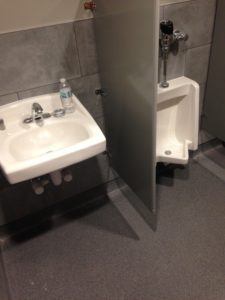 Public bathroom sink and urinal installed by Heggemann Inc.