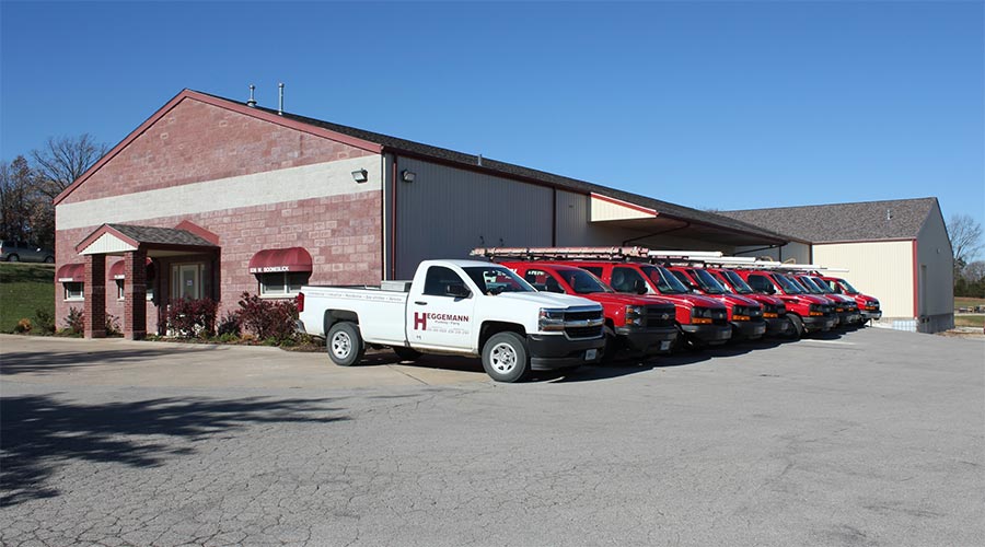 Heggemann Inc. office building with maintenance trucks parked out front 