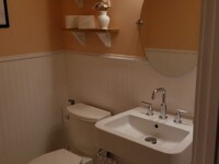 A guest bathroom sink with silver hardware accents.