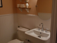A guest bathroom sink with silver hardware accents.