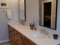 Stylish bathroom with floor tiles and silver hardware accents.