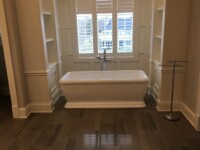 A large tub in a master bathroom.