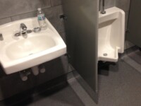 Public bathroom sink and urinal installed by Heggemann Inc.