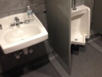 Public bathroom sink and urinal installed by Heggemann Inc.
