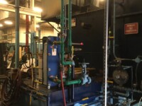 Industrial room with exposed plumbing pipes